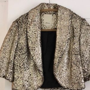 Gold shrug